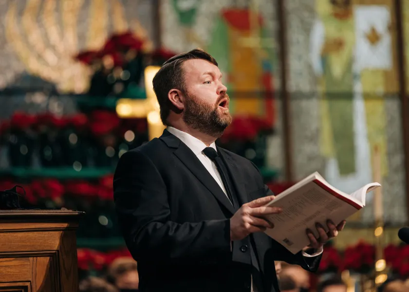man singing in church