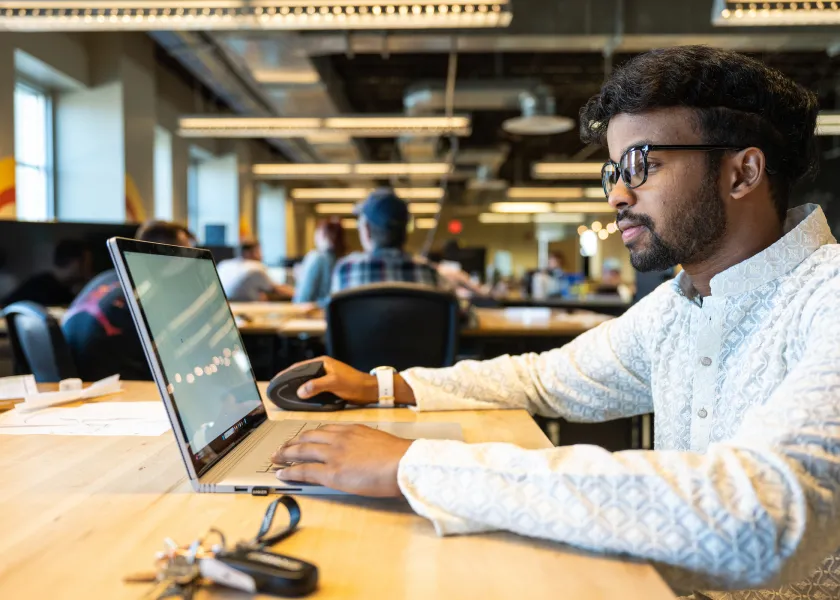 student working on a laptop