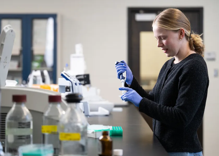 student working with sample in lab